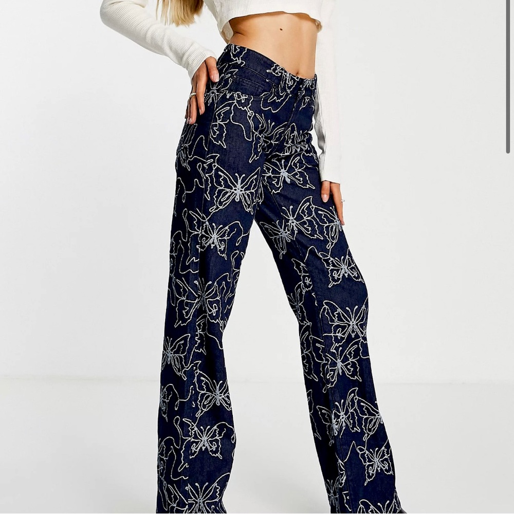 Jaded London low rise boyfriend fit denim jeans in embossed butterfly